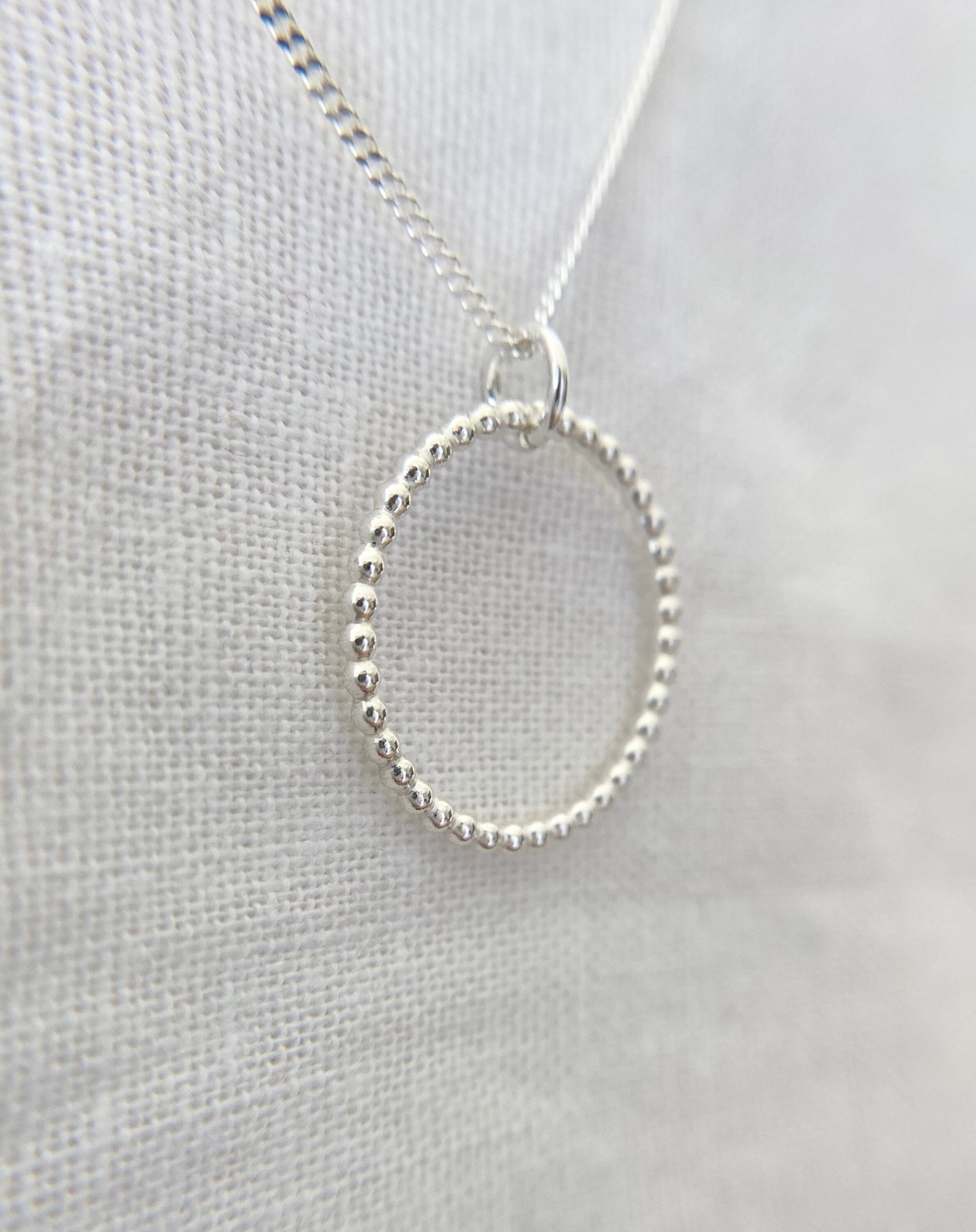 Sterling Silver Circle Pendant Necklace with Bead Effect