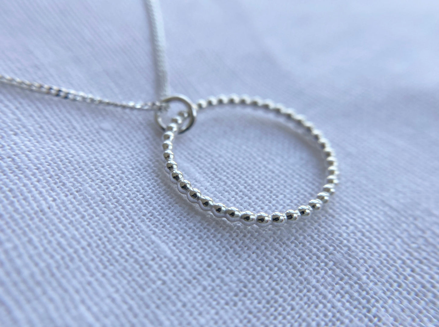 Sterling Silver Circle Pendant Necklace with Bead Effect