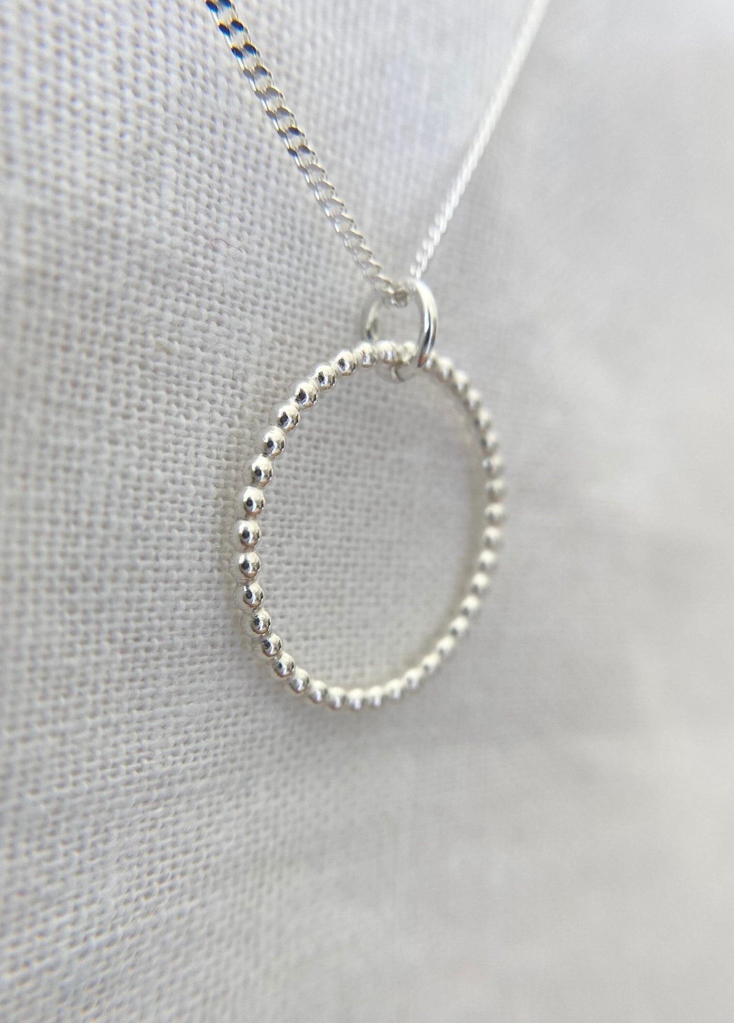 Sterling Silver Circle Pendant Necklace with Bead Effect