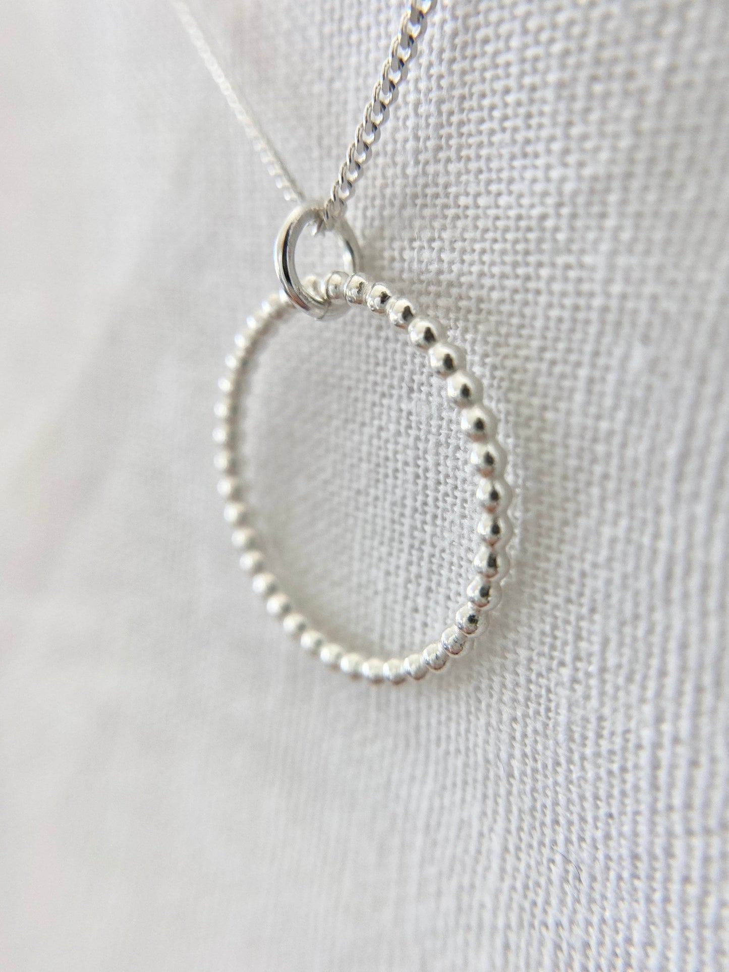 Sterling Silver Circle Pendant Necklace with Bead Effect