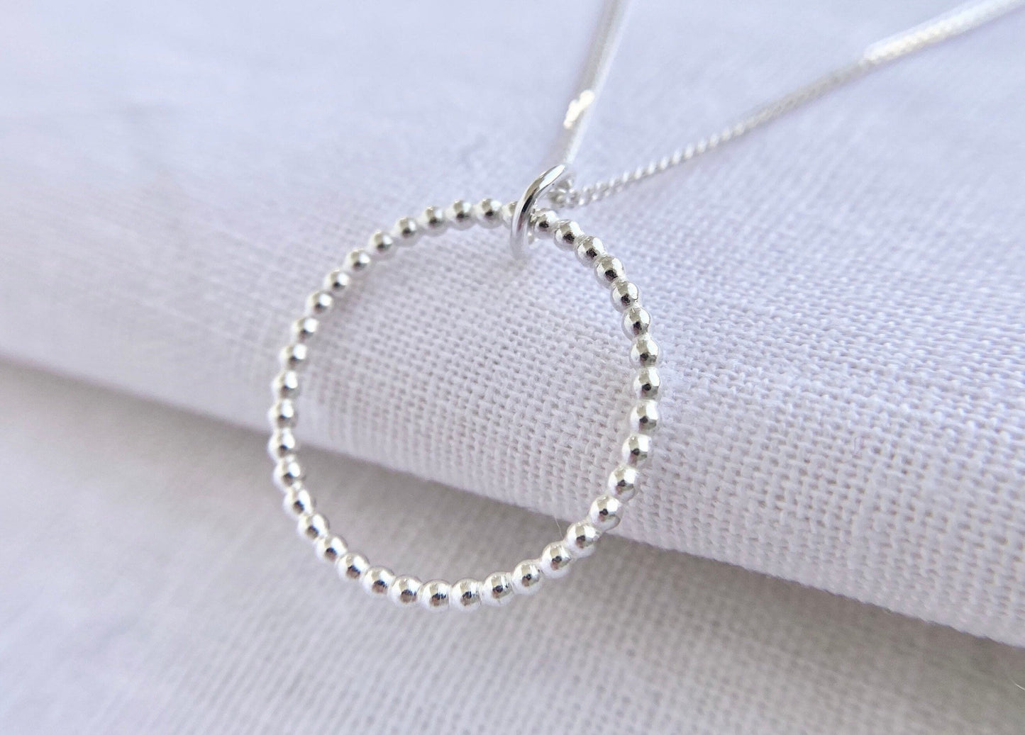 Sterling Silver Circle Pendant Necklace with Bead Effect