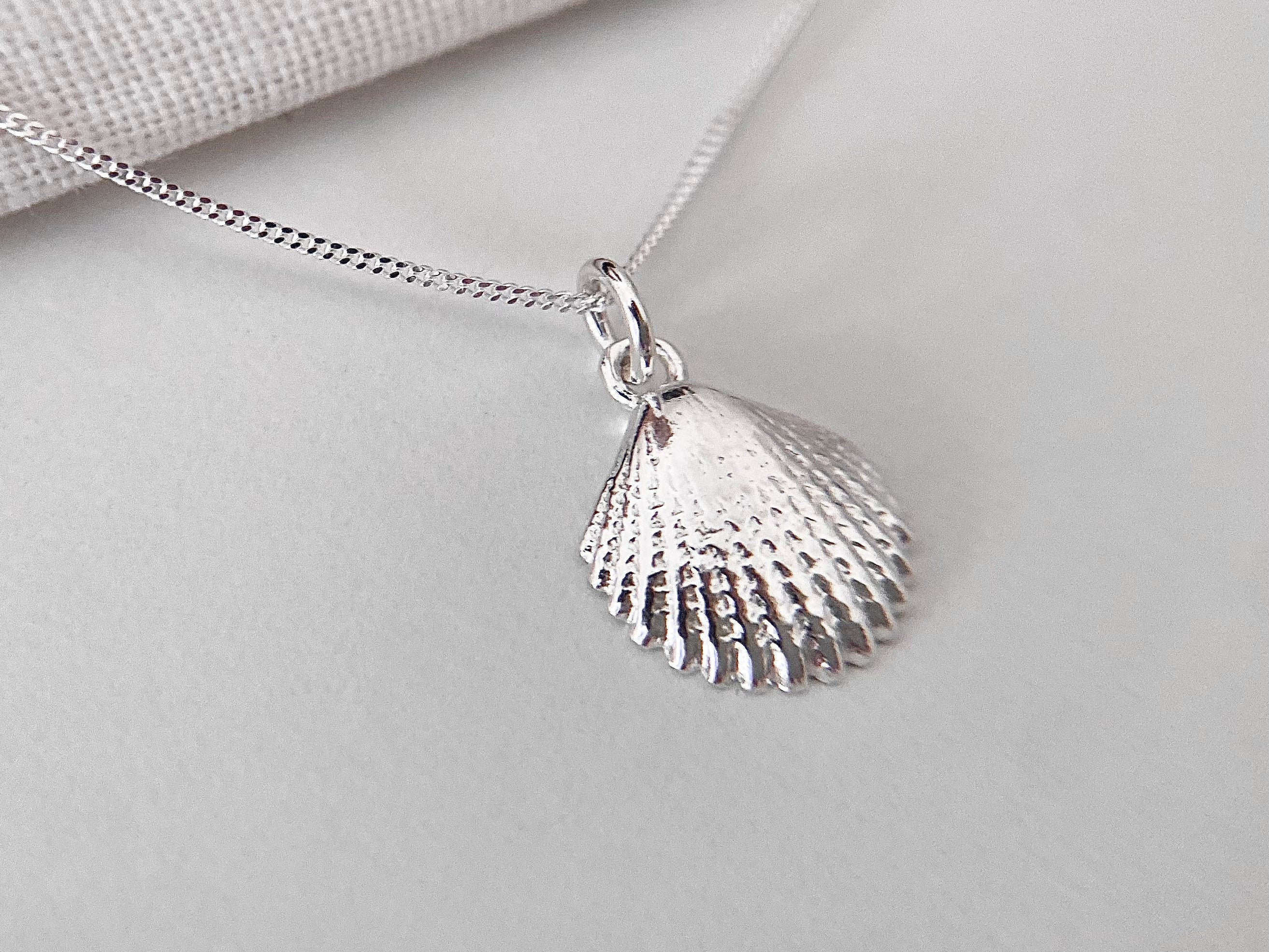 Silver on sale shell pendant